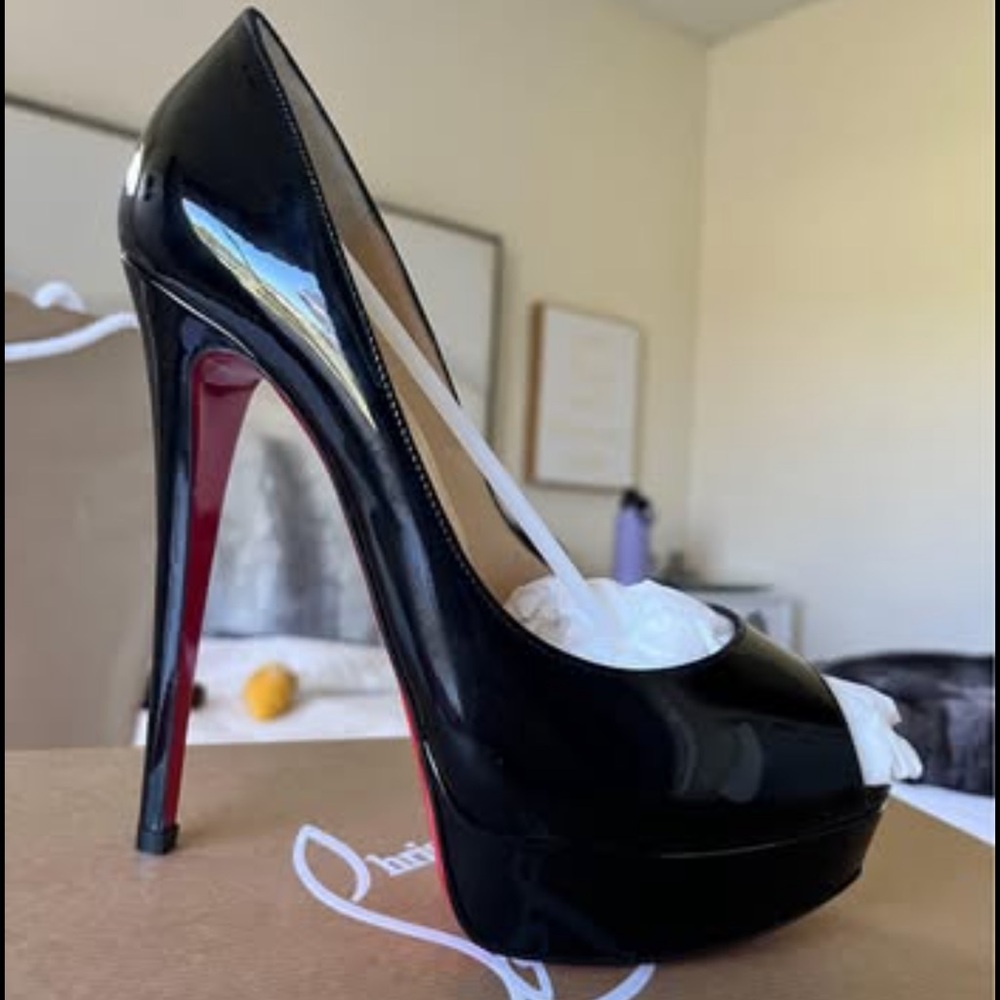Christian Louboutin Black and Red Heels
NEW NEVER WORN